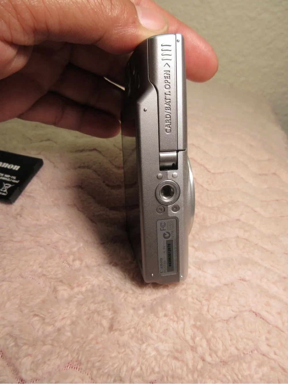 Canon Silver Compact Camera with Black Charger and Accessories